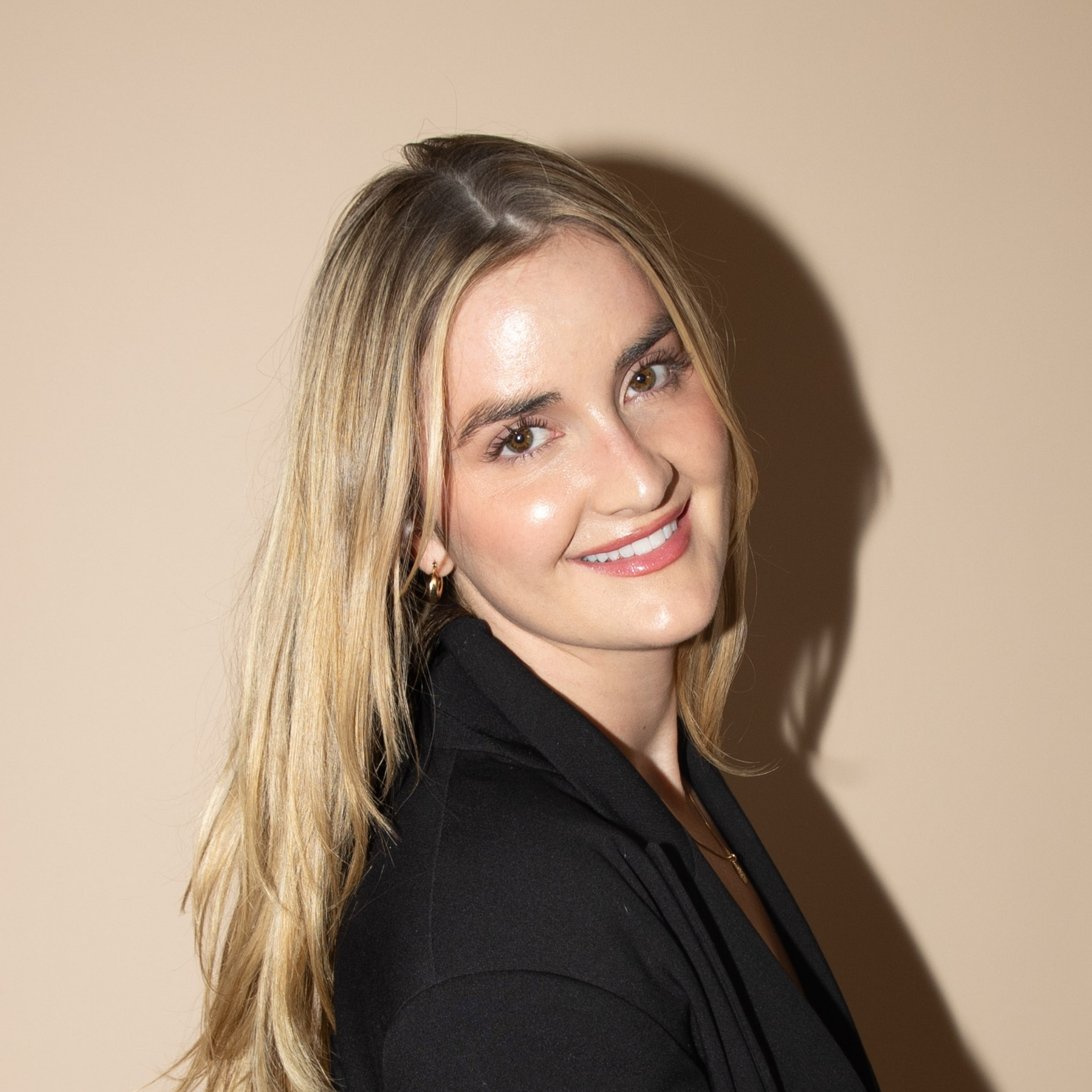 Smiling woman with long blond hair.